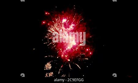 Close up isolated image of a firework show as multiple fireworks explode at the same time. Image features a colorful scene on dark night sky backgroun Stock Photo