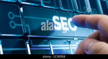 Man Using a SEO System by Pressing a Button on Futuristic Interface. New Business Concept Stock Photo