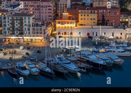 View from Colline du Chateau down to Port Lympia at dusk, Nice, Cote d'Azur, France, Europe