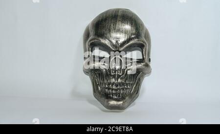 Metal Human Skull Mask For Using In Entertainment Purpose On White Background. Stock Photo