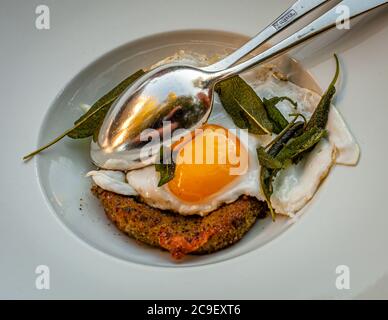 Scamorzo fritta - a cheese from Puglia in herb breading and with free-range egg and ointment. Gourmet Dish in Hotel Mühle in Binzen, Germany Stock Photo