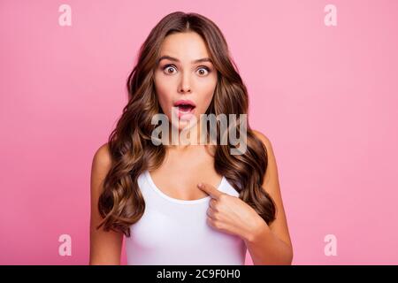 Are you sure. Photo of pretty wavy shocked lady crazy facial expression open mouth directing finger chest doubts about decision wear white casual Stock Photo