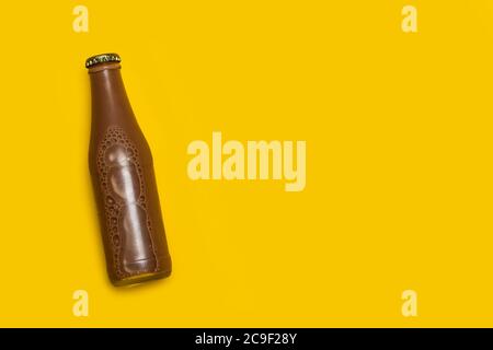A bottle of chocolate milk on a yellow background with copy space Stock Photo
