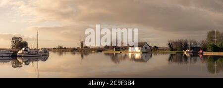 Looking across the river Yare to St Bennets Mill on an Autumn morning Stock Photo