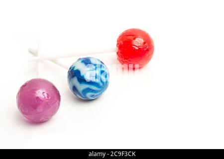 Three colored lollipops isolated on a white background Stock Photo