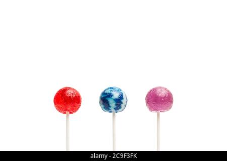 Three colored lollipops isolated on a white background Stock Photo