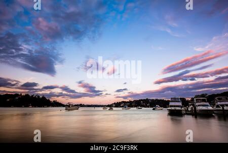 Sunset Scape over Carina Bay Jetty, Marina, and Georges River in Como Stock Photo