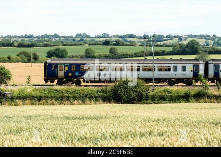 Northern Class 156 Super Sprinter diesel multiple unit on the West Coast Main Line, Northamptonshire, England, UK Stock Photo