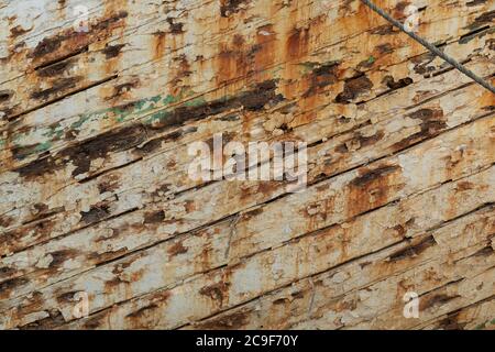 Grunge wood background with white peeling paint, from an old ship in Indonesia. Stock Photo