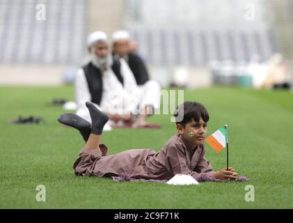 Kamil Ayub, aged 6, holds an Irish flag in Croke Park, Dublin, as mosques across Ireland are marking the occasion of Eid Al Adha, the festival of sacrifice - with the largest event taking place at GAA headquarters in Dublin. Stock Photo