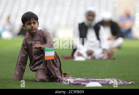 Kamil Ayub, 6, holds an Irish flag in Croke Park, Dublin, as mosques across Ireland are marking the occasion of Eid Al Adha, the festival of sacrifice - with the largest event taking place at GAA headquarters in Dublin. Stock Photo