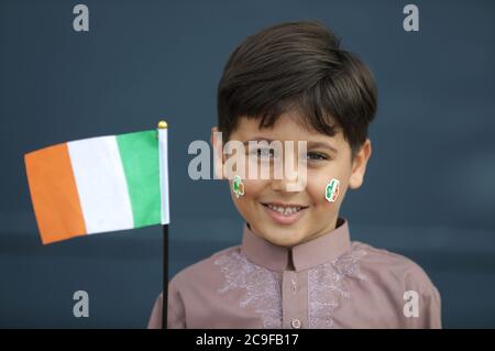 Kamil Ayub, 6, holds an Irish flag in Croke Park, Dublin, as mosques across Ireland are marking the occasion of Eid Al Adha, the festival of sacrifice - with the largest event taking place at GAA headquarters in Dublin. Stock Photo