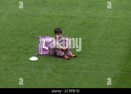 Kamil Ayub, 6, holds an Irish flag in Croke Park, Dublin, as mosques across Ireland are marking the occasion of Eid Al Adha, the festival of sacrifice - with the largest event taking place at GAA headquarters in Dublin. Stock Photo