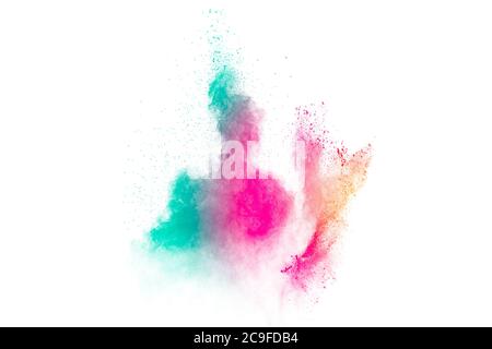 Colored powder explosion. Abstract closeup dust on backdrop. Colorful explode. Paint holi. Stock Photo