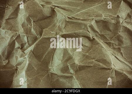 Beige crumpled paper background. Close up. Stock Photo