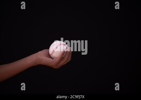 Baseball in hand of individual with copy space Stock Photo