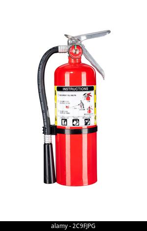 A classic red fire extinguisher isolated on white for use as a design element or safety inference for home and business protection. Stock Photo