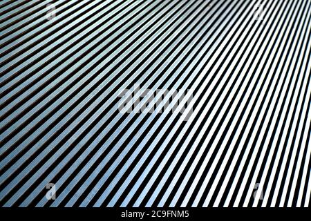 Diagonal converging silver lines on a steel surface. Stock Photo