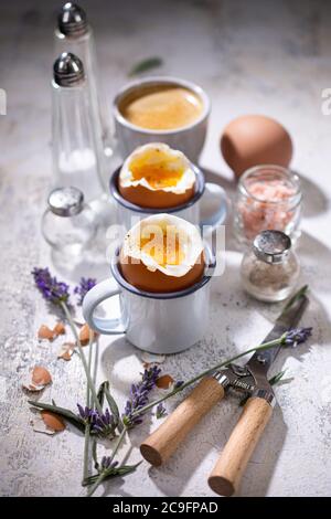 Soft boiled eggs.Breakfast with coffee.Country style.Healthy food and drink. Stock Photo