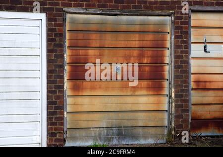 A rusty garage door stands out clearly in this photo taken on a bright autumn day Stock Photo