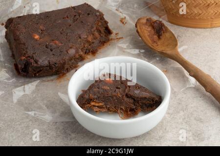 Piece of tamarind paste close up in a white bowl Stock Photo