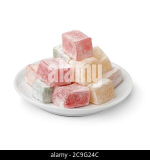 White dish Turkish delight with a variation of taste and color isolated on white background Stock Photo