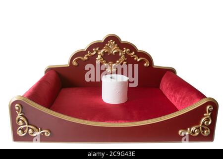 Toilet paper on a royal red velvet pillow getting worshipped during covid-19 Stock Photo