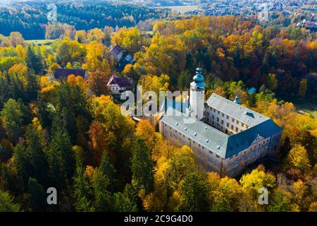 Scenic autumn forest landscape of Lusatian Mountains with ancient Lemberk Castle near town of Jablonne v Podjestedi, Czech Republic Stock Photo