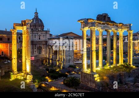 The Temple of Vespasianus and Titus (left), Septimius Severus Arch (center) and The Temple of Saturn (right) in the Roman Forum - Rome, Italy Stock Photo