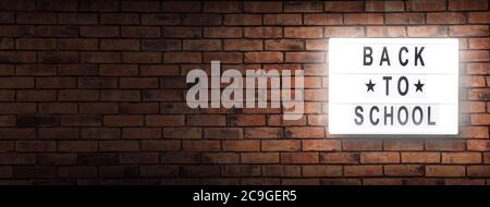 back to school letterboard text -  background with copy space on red bricks wall Stock Photo