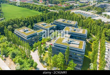 Aschheim, Germany - July 27, 2020: The modern steel-glass-building of the „Wirecard AG“ with logo. Stock Photo