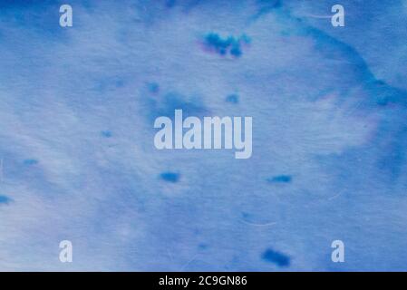 blue color painted on paper background texture Stock Photo