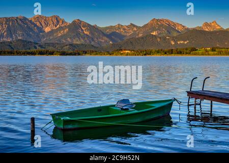 Green rowboat, lake Hopfensee, Hopfen am See, near Fuessen, Ostallgaeu, Allgaeu, Bavaria, Germany Stock Photo