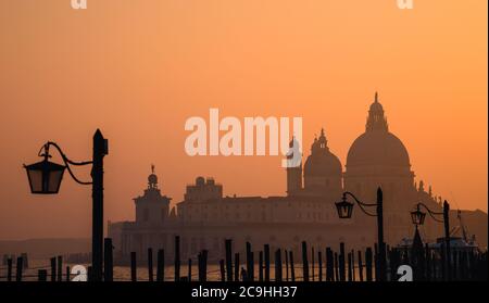 Santa Maria della Salute basilica in a foggy Sunset Stock Photo