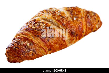 One multigrain croissant sprinkled with seeds of brown and gold flax. Isolated over white background Stock Photo