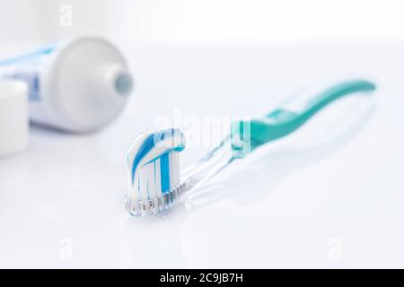 Toothpaste on a toothbrush on a white background Stock Photo - Alamy