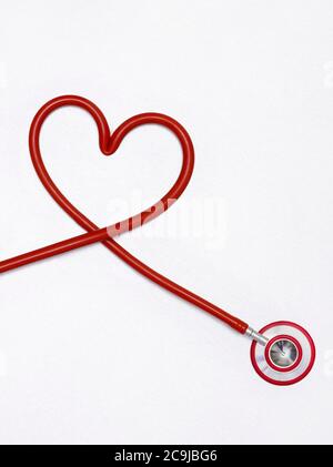 Stethoscope in a heart shape against a white background. Stock Photo