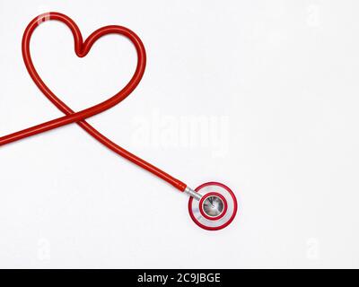 Stethoscope in a heart shape against a white background. Stock Photo