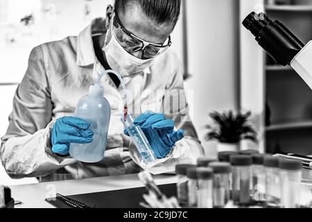 Forensic Science Laboratory. Forensic Scientist working in laboratory, extracting DNA. Stock Photo