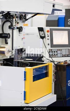 Automated metal cutting machine. Stock Photo