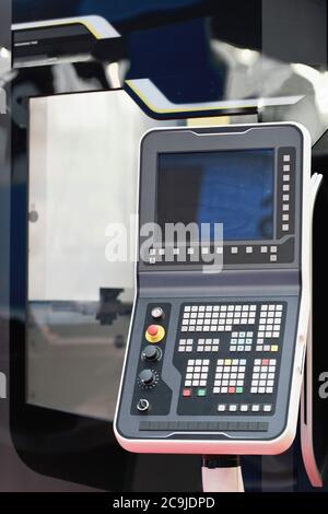 Command console on industrial vertical machining system. Stock Photo