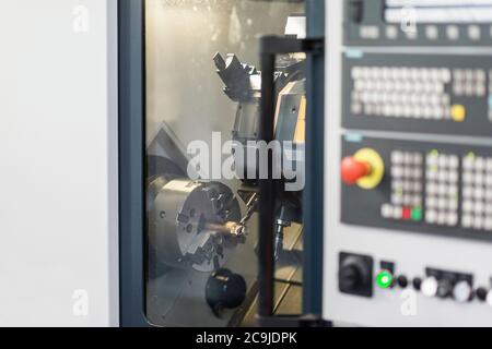 Automated CNC toolroom lathe with control console. Stock Photo
