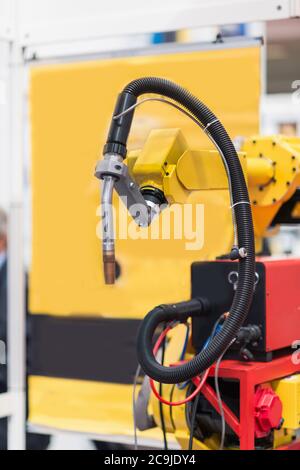 Industrial robotic arm in a high tech factory. Stock Photo