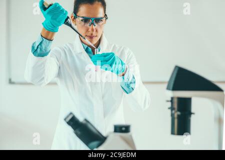 Female scientific researcher working in laboratory. Stock Photo