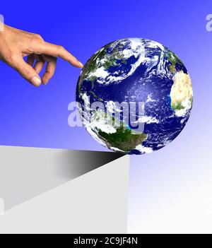 Person pushing planet earth of the edge, composite image. Stock Photo