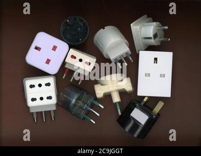 Many British and European adapter plugs and sockets Stock Photo