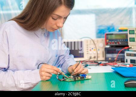 Engineer working on circuit board. Stock Photo