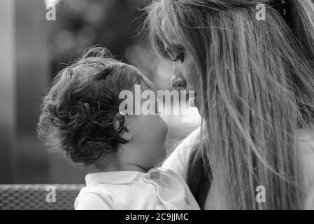 Young beautiful blonde mother with adorable baby son together