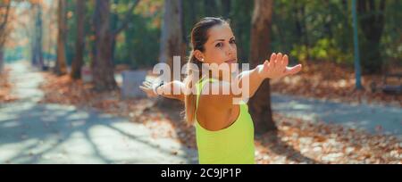 Woman stretching in the park. Stock Photo