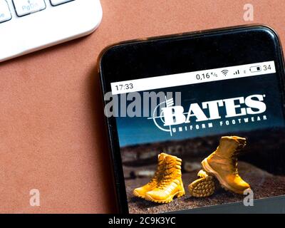 In this photo illustration e-commerce a Bates Footwear logo is seen displayed on a smartphone Stock Photo